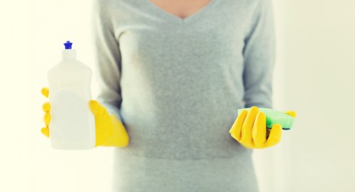 Professional cleaner maintaining shared corridor and stairwell areas