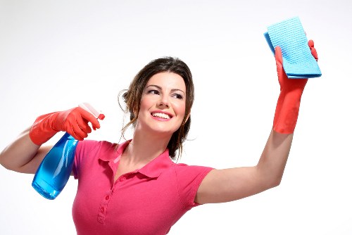 Cleaning living room floors and dusting surfaces in a new home